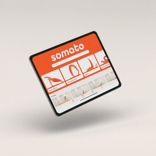 Tablet displaying the Somato pilates app with on-demand Pilates and reformer classes