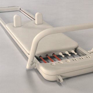 The Somato Pilates reformer sitting open on a seamless in the photo studio.